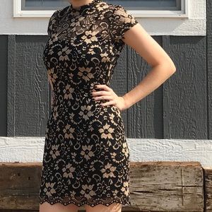 Black and gold fitting dress